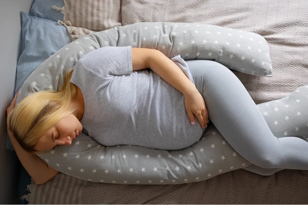How To Sleep With A Pregnancy Pillow